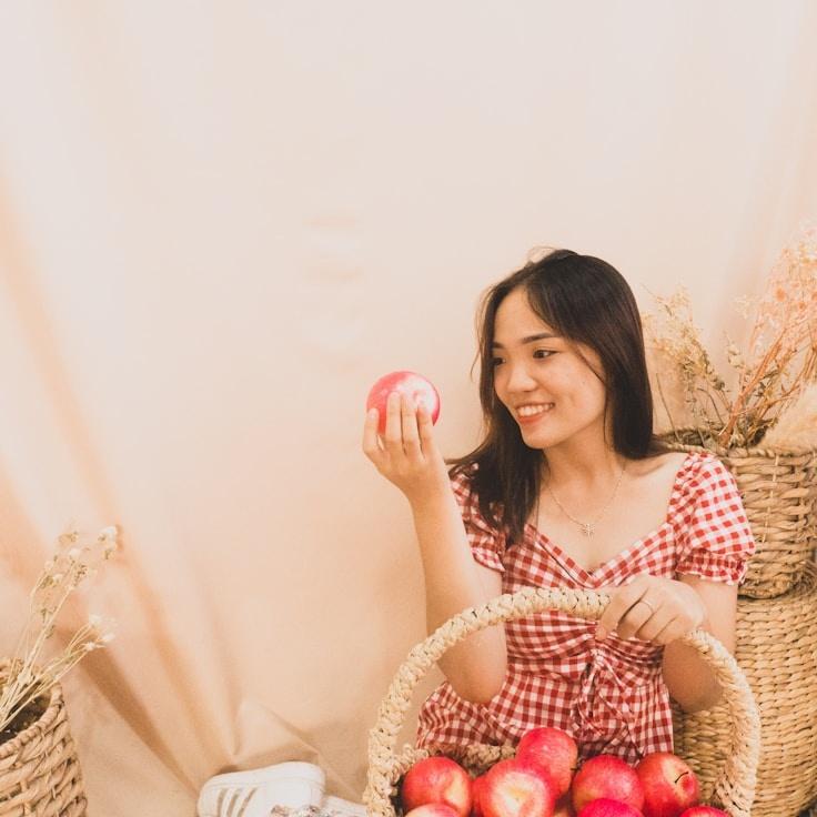 Avery Singh, Lead Design Curator at TideFieldFolio, reviewing corporate floral arrangements